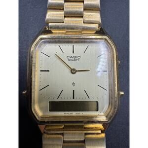 Vintage Casio AQ-222 Gold Tone Unisex Analog & Digital 30.6mm Watch